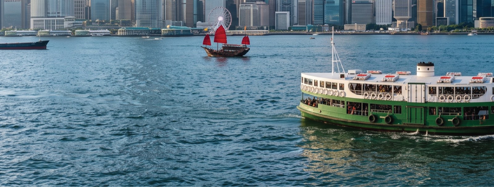 Hong Kong harbour with a ferry and traditional junk boat